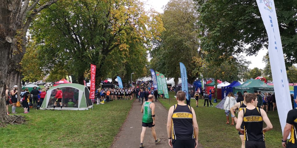 The central path of the park flanked by club tents, gazebos and runners