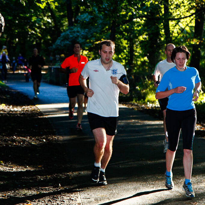 Stewart wearing an old England football shirt looking very tired on the last stretch of Cardiff parkrun.